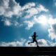 Silhouette of a person jogging.