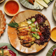 Regional Thai dishes from Chaiya's menu shared on one table